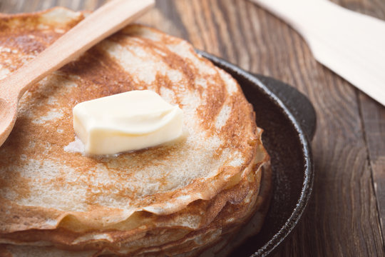  Stack of fresh homemade crepes with butter on top
