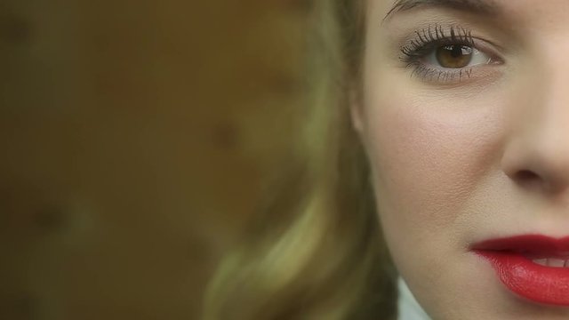 Sexy beautiful blond female with red lips flirting, femme fatale seducing man