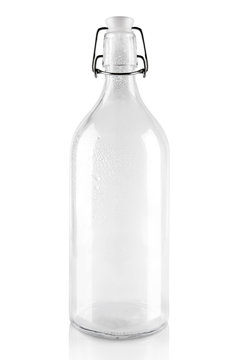 Empty transparent bottle isolated on the white background