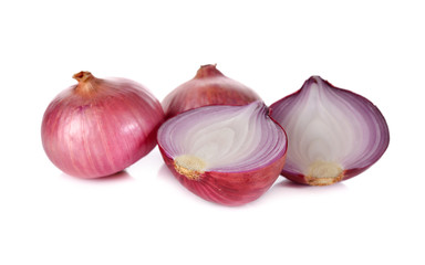 whole and half cut red onion, shallots on white background