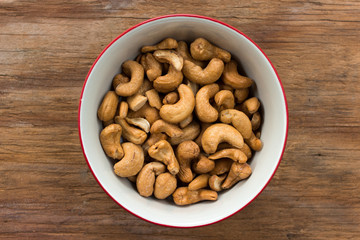 cashew nut in bowl on wooden background