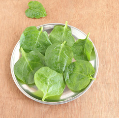 Healthy food vine spinach, also known by such names as climbing spinach or creeping spinach, in a plate.