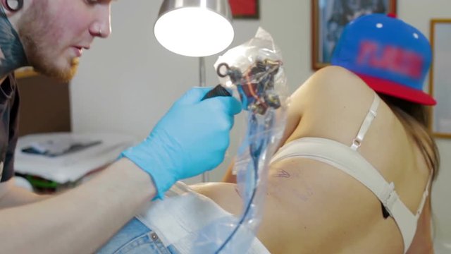 Tattoo artist make tattoo at studio