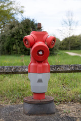 Fototapeta na wymiar old red hydrant for fire fighting on white background