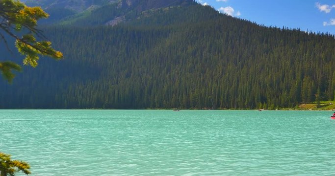 4K Turquoise Lake Louise, Canoes Paddling, Banff Alberta