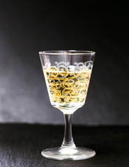 liquer glass over slate background