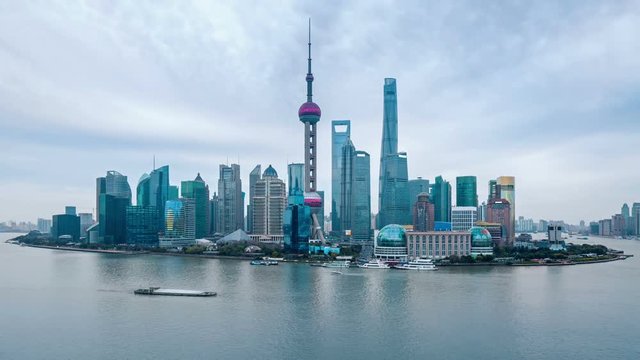 time-lapse of shanghai lujiazui finance trade zone panorama and the huangpu river at dusk