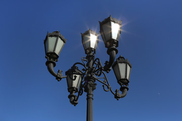 Decorative lamppost with blue background