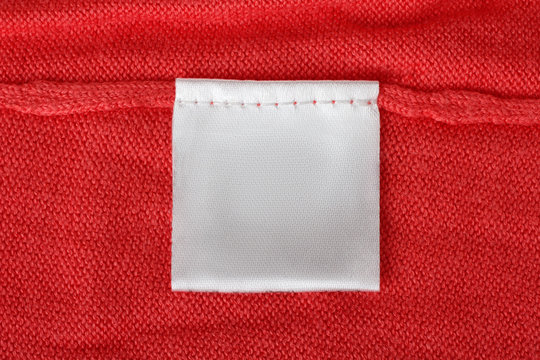 Texture Red Clothing Or Fabric With Tag Closeup