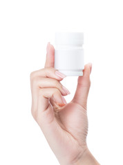 Hand holding a pill bottle isolated on white with clipping path.