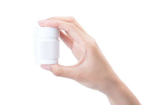 Hand Holding A Pill Bottle Isolated On White With Clipping Path.