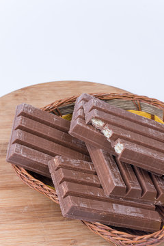 Close macro chocolate bars woven basket decoration