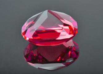 red ruby with reflection on grey