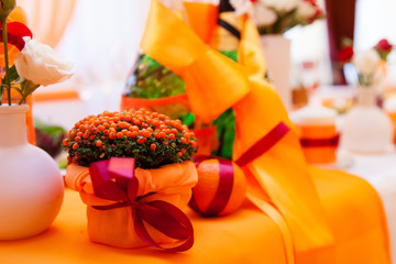 Wedding table decorated in orange colors 