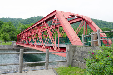 Fototapeta na wymiar Structure of red old iron bridge