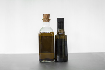 Full shot oil in two glass containers isolated