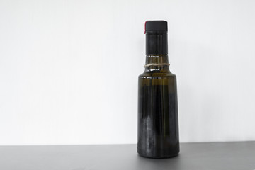 Full shot oil in glass container isolated