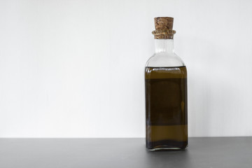 Full shot oil in glass container isolated