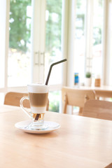 Cup of Hot  Latte Coffee on wood table
