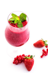 fresh red smoothie with mint leaf in glass isolated on white background, strawberry, red currant, beetroot and apple drink, product photography for healthy lifestyle