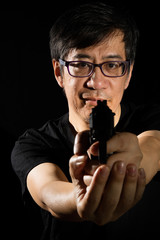 Asian Chinese Man Holding a Gun