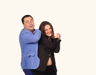 Man and woman with funny faces isolated over white background