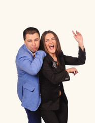 Man and woman with funny faces isolated over white background