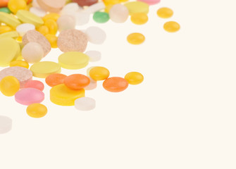 Heap of pills on white background