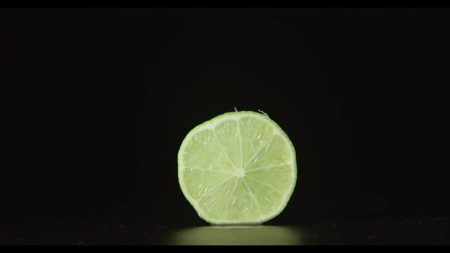 Human hand takes away a half of lime