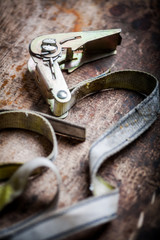 Ratchet tie down on wooden plank