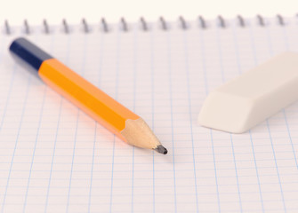 Notepad with pencil and eraser