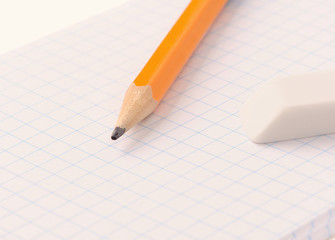Notepad with pencil and eraser