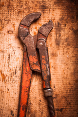 Adjustable spanner on wooden plank