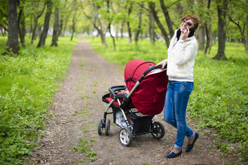 Fototapeta na wymiar woman with a baby carriage