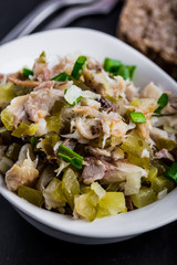 Salad with smoked fish, eggs and cucumber