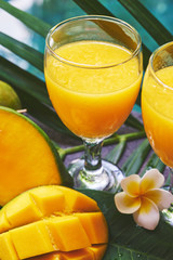 Glasses of fresh tropical smoothie or mango juice