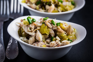 Salad with smoked fish, eggs and cucumber