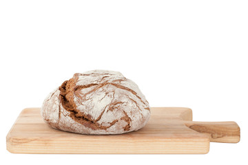 Homemade bread on wooden cutting board isolated on white backgro