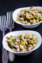 Salad with smoked fish, eggs and cucumber