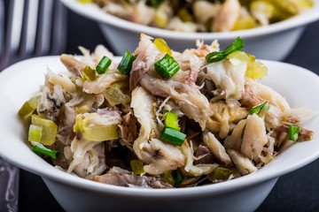 Salad with smoked fish, eggs and cucumber