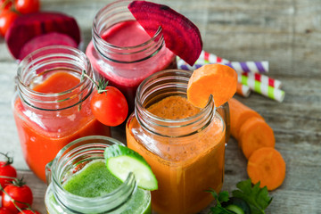 Selection of colorful vegetable juices in glass jars