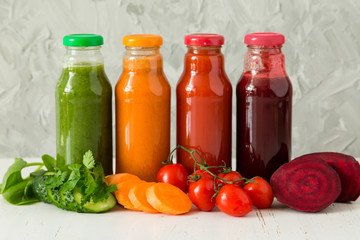 Selection of colorful vegetable juices in glass jars