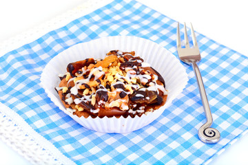 Homemade Cakes: Cake on Plate with Nuts, Chocolate and Raisins.