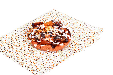 Homemade Cakes: Cake on Plate with Nuts, Chocolate and Raisins.