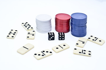 dominoes, chips and dice on a white background