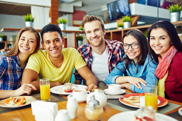 Portrait of friends in cafe