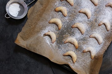 Crescent cookies on dark moody background, selective focus