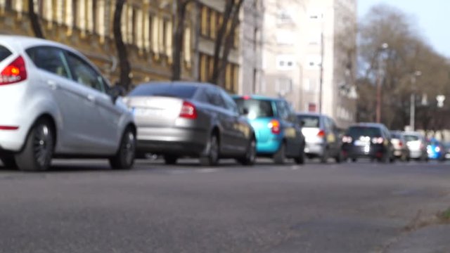Cars starts at green traffic light defocused