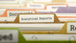 file folder labeled as analytical reports in multicolor archive. closeup view. blurred image. 3d render.