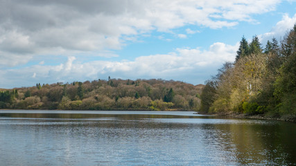 A landscape photograph of a resivior surrounded beautiful countryside located in Cornwall and Devon.